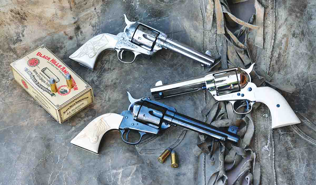 Examples of single-action revolvers chambered in .44 Russian include, top to bottom: a first generation Colt Single Action Army (engraved), Colt first generation Single Action Army and a USFA Flattop Target SAA pattern with dual calibers.